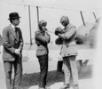 Original title:  H.R.H. the Prince of Wales and Lieutenant-Colonel W.G. Barker, V.C., preparing for flight in a Sopwith Gnu aircraft. 
