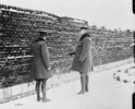 Original title:  Gen. Currie visits Cemetery in Andenne where 200 civilians were shot by Germans against a wall, 21st. August 1918. 