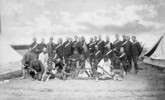 Original title:  Chief Piayot (ca. 1816-1908), Chief Cree and leader, and followers; Edgar Dewdney, Indian Commisioner for the North-West Territories; and members of the Montreal Garrison Artillery, Regina, Sask., May 1885. 
