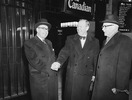 Original title:  L. to R.: Hon. Paul Martin, Hon. Lester B. Pearson and the Rt. Hon. Louis St. Laurent at Ottawa after Pearson's return from Norway with the Nobel Peace Prize. 